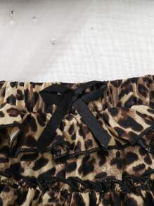 SHEIN Set de 2 piezas de top con tirantes y falda casual con estampado de leopardo y volantes para niña joven