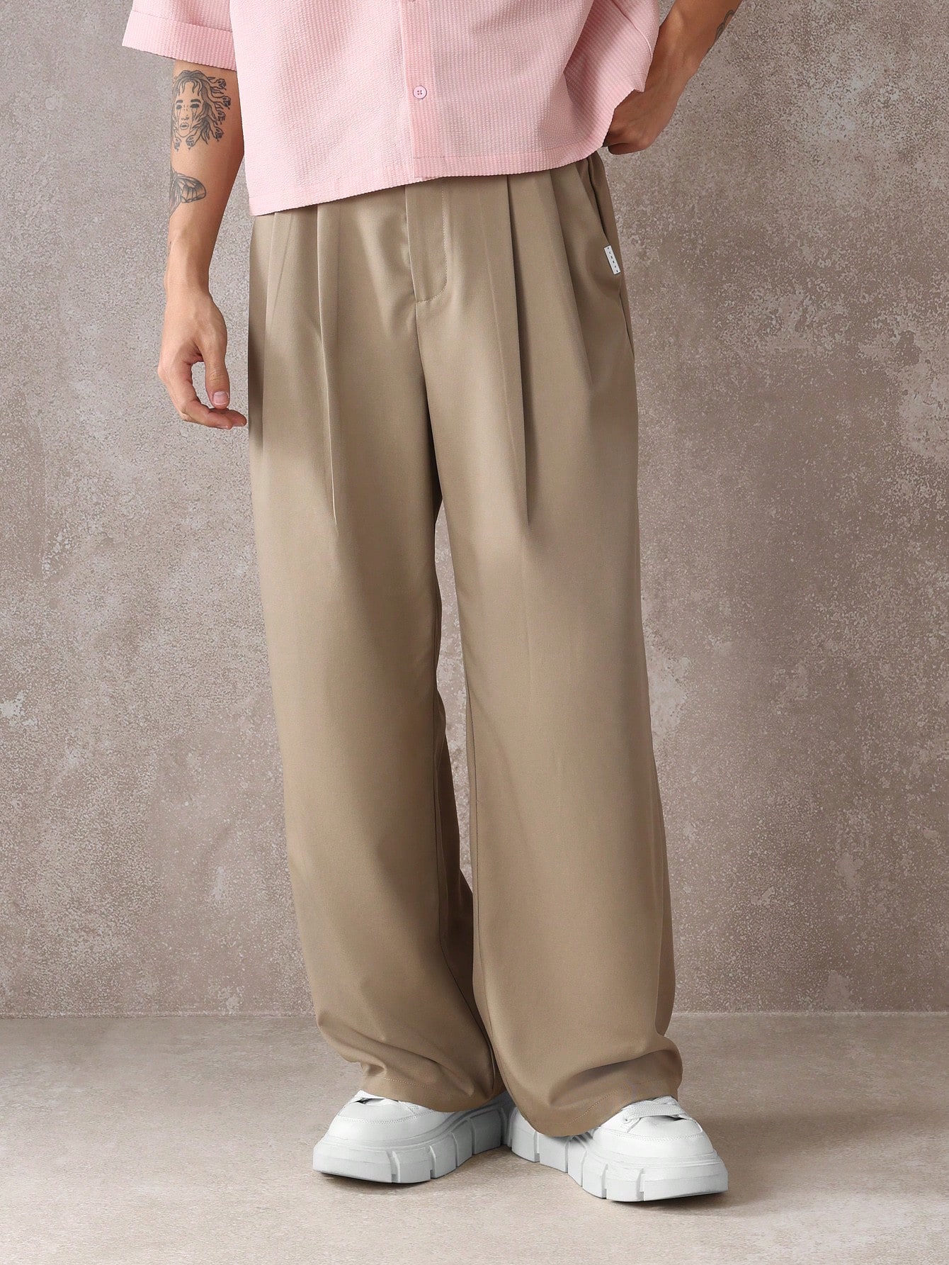 Pantalon élégant à jambes larges et décontractées avec doubles plis