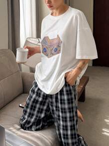 DAZY Conjunto de pijama para mujer con Top de camiseta con estampado gráfico y pantalón holgado y recto a cuadros