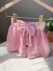 Comfortcana Shorts in stile vacanza al mare, a vita bassa, lavorati a maglia, con motivo a fiocco e design traforato