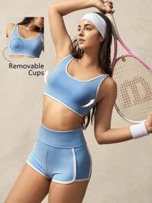 VARSITIE Sujetador deportivo con bloqueo de color azul y blanco y espalda con torsión y tirantes - Azul - Ver 1