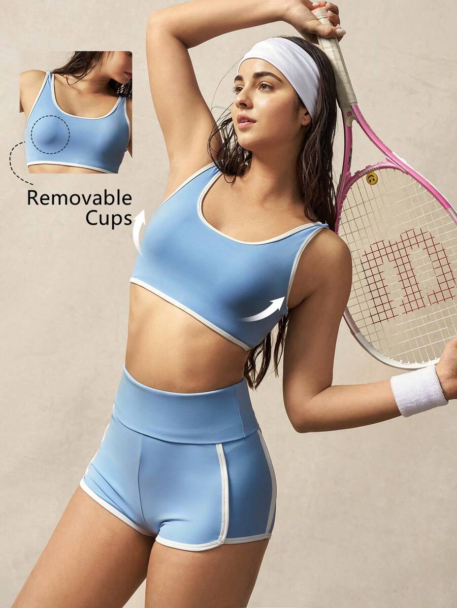 VARSITIE Sujetador deportivo con bloqueo de color azul y blanco y espalda con torsión y tirantes - Azul - Ver 1