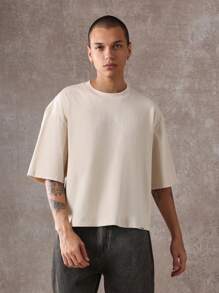 SUMWON Oversized unisex Statement Lifestyle kurzes T-Shirt, lässiger Street-Style, moderne urbane Mode, "Unbothered" Slogan Muster, Baumwoll-Jersey Loungewear Oberteil - Aprikosenfarben - Übersicht 2