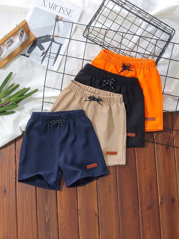 SHEIN 4 pièces Paquet Short décontracté de jeune garçon, streetwear sport mignon et élégant, taille élastique unie. Convient pour le port quotidien, l'école, l'extérieur, les sports, les saisons de printemps/été. Offre des options de tenue diversifiées et un look confortable et pour les jeunes garçons