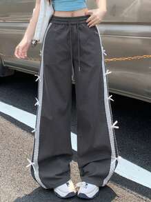 DAZY Pantaloni casual da donna con vita elastica, decorati con patchwork in pizzo e fiocco