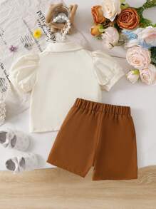 SHEIN Vintaside Kids Bộ 2 món áo sơ mi ngắn tay cài cúc cổ bẻ in hoa và quần short cạp chun cho bé gái, trang phục thường ngày dễ thương cho mùa xuân/hè/thu. - màu nâu - Xem 3