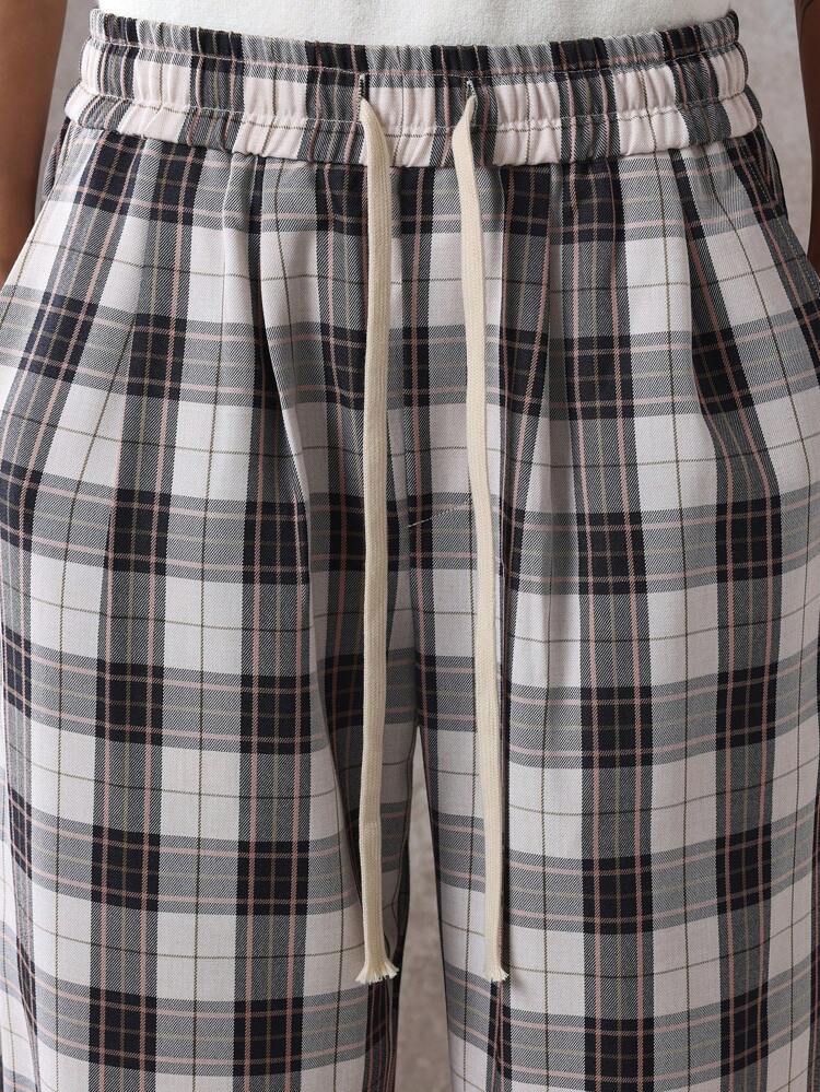 Calça casual xadrez com corte relaxado e cordão, perna larga