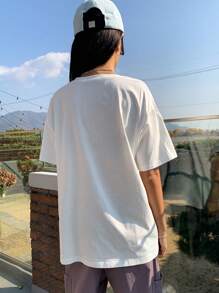DAZY Camiseta oversize con gráfico de paisaje y eslogan, cuello caído