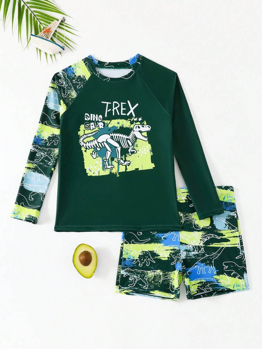 SHEIN Tween Tween Boys' Printed Two Pieces Swimwear, This Tween Boys' Swimwear Features A Unique And Eye-Catching Dinosaur Print Design On A Blue Background, Showcasing An Adventurous Spirit. The Soft And Comfortable Material Is Suitable For Various Water Activities. The Long Sleeve Design Can Effectively Block The Sun And Protect Delicate Skin. This 2025 New Swimming Suit Is Perfect For Young Tween Boys Who Love Swimming, Making Them More Confident In The Water. - Multicolor - View 1