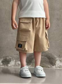 SHEIN Young Boys' Casual Solid Color Loose Cargo Shorts With Oversized Pockets, Elastic Waist, Khaki, Versatile Bottom Wear Suitable For School, Birthday Parties, Performances, Weddings, Baptisms, School Openings, Everyday, Spring And Summer - Khaki - View 5