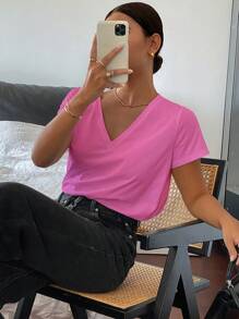 Livesso Camiseta casual holgada de manga corta con cuello en V de unicolor para mujeres, casual de oficina