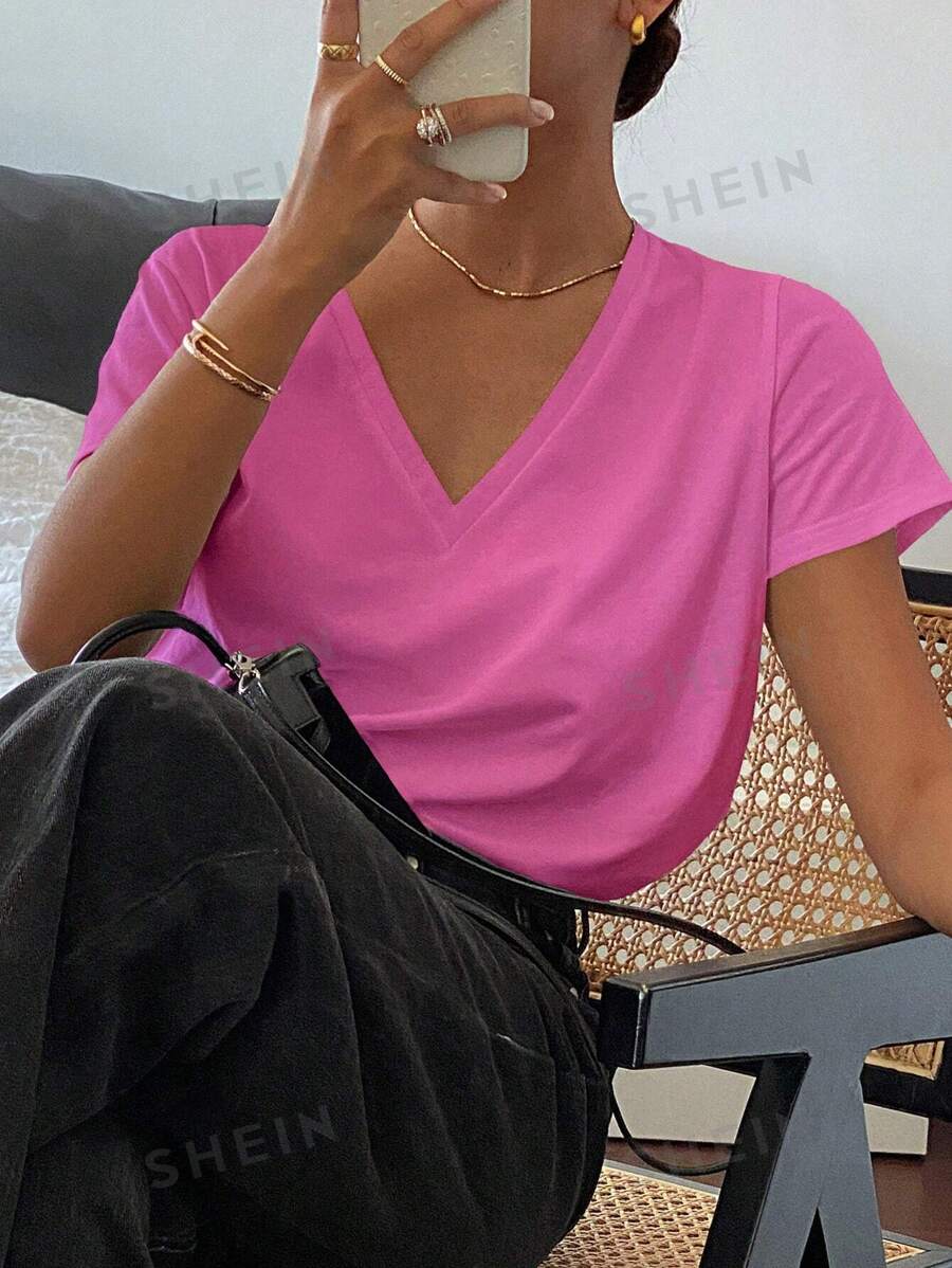 Livesso Camiseta casual holgada de manga corta con cuello en V de unicolor para mujeres, casual de oficina