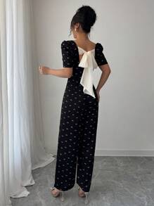 Modelyn Damen Schleifendruck rückenfrei V-Ausschnitt kurze Ballonärmel eleganter Jumpsuit