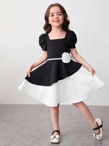 Vestido midi de niña con mangas abullonadas, bloque de color blanco y negro, bajo asimétrico y decoración de flores 3D. Adecuado para uso diario, reuniones familiares y ocasiones especiales