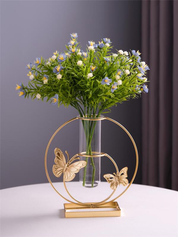 Geometric gold vase center decorated with glass vases with artificial