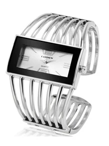 Reloj de pulsera de mujer de cuarzo con diseño hueco y brazalete de moda