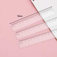 1 pieza Regla recta de plástico de 5cm con patrón de onda, transparente, para estudiantes de 1er grado de primaria, artículos de papelería, reglas - Multicolor - Ver 1