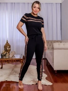 Conjunto Com Faixa Modeladora preto com animal print Dondoka