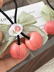 1入組女童珊瑚粉色櫻桃造型綁髮圈,配有蝴蝶結,不傷髮