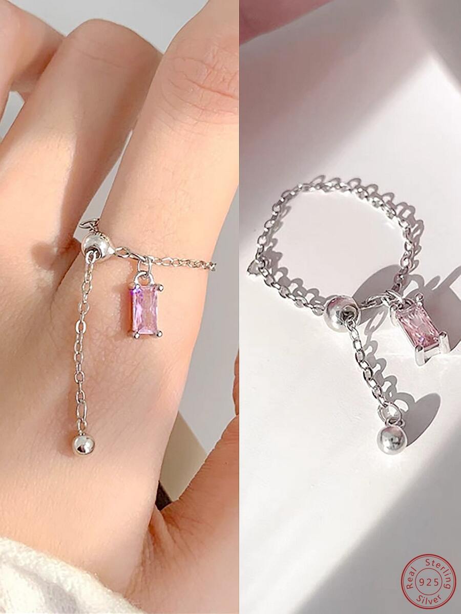 这款时尚简约优雅的方形立方氧化锆石可调节链戒指，共有三种颜色可选。适合节日、婚礼、派对、周年纪念、日常佩戴和服装搭配。纯银材质赋予其高级质感，尺寸可调节。 - 粉色 - 查看 1