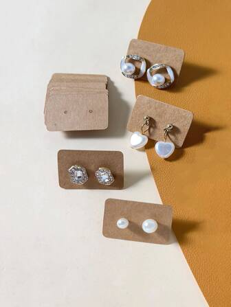 100 piezas Arete almacenamiento exhibición con Papel de embalaje