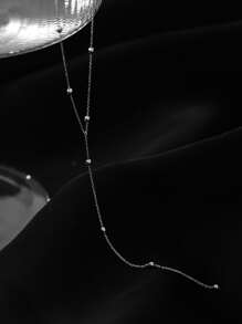 1條簡約流蘇和珠飾y字長項鏈,適合女性日常穿著