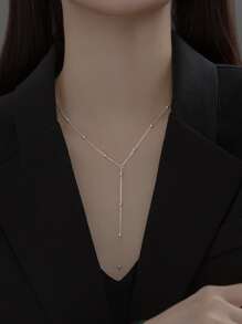 1條簡約流蘇和珠飾y字長項鏈,適合女性日常穿著