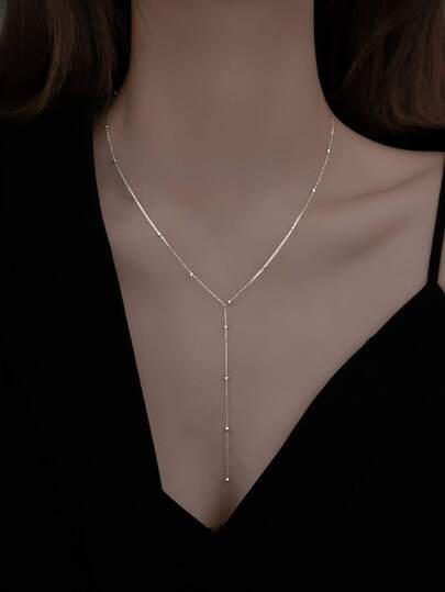 1條簡約流蘇和珠飾y字長項鏈,適合女性日常穿著