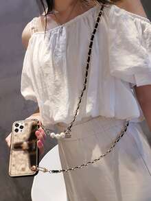 1個黑色金屬手機掛繩斜橫背包,1個黑色金條與金珠設計的防丟手機斜橫背包鏈