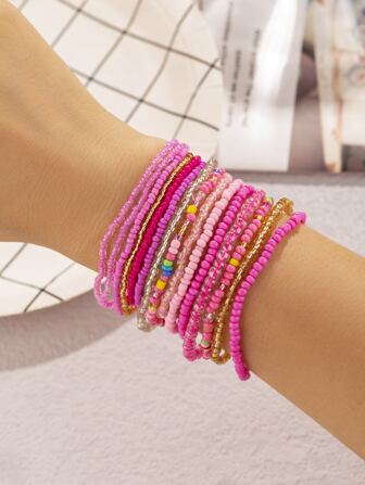 Set de 15 piezas de pulseras apiladas con cuentas de resina, en color rosa