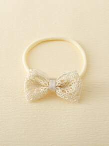 1對嬰兒防滑蝴蝶結襪子和1頂嬰兒髮箍