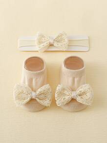 1對嬰兒防滑蝴蝶結襪子和1頂嬰兒髮箍