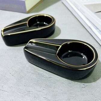 1個12*6.6*2.8公分黑色陶瓷煙灰缸,金色線條設計,便攜式單槽橢圓錐形小雪茄煙灰缸,適用於家庭、酒店、餐廳、派對使用