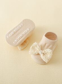 1對嬰兒防滑蝴蝶結襪子和1頂嬰兒髮箍