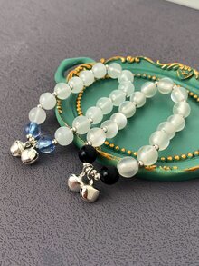 1入組迷人的設計鈴鐺墜飾手環適合女士,彈性帶可調尺寸,穿戴,燈藍白色