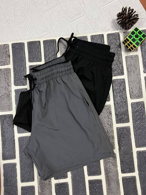 Kit com 2 Shorts Tactel Neon , ideal para todas as ocasiões, Praia, Academia, Corrida, Casual. Com Símbolo Bordado na Perna, 2 Bolsos  Possui Elástico na Cintura e Cordão para Ajuste, podendo ser usado para fora ou para dentro do short.