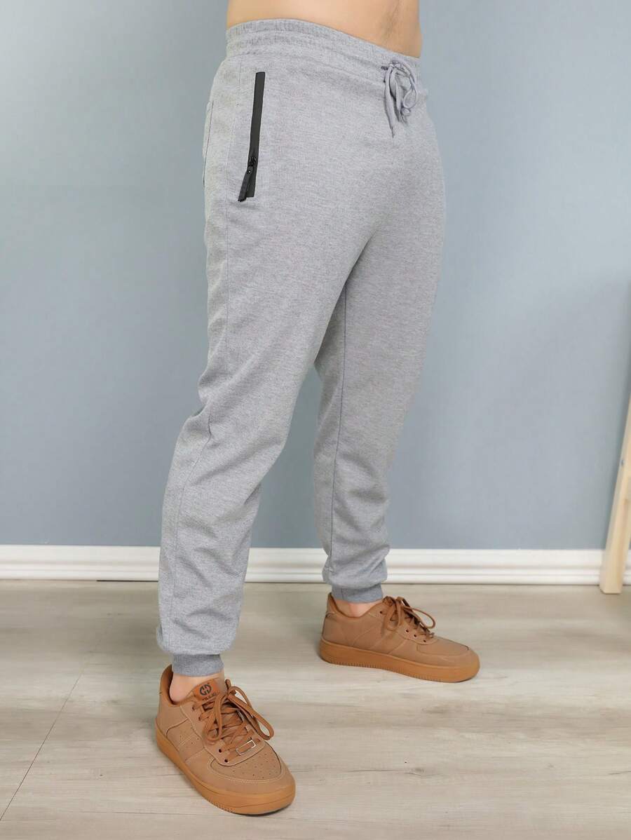 Calça Jogger de Moletinho Masculina para Atividade Física em Academia e Corrida - Cinza Claro - Visão 1