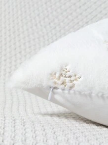 1個印有聖誕雪花圖案的天鵝絨靠墊,銀色燙印工藝