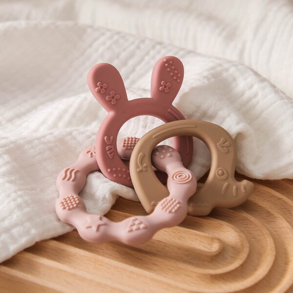 One Baby Silicone Teether Ring In Pink Color With Rabbit And Elephant Design, Suitable For Teething Period, A Gift For Babies
