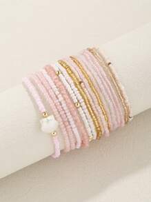 Conjunto de 17 brazalete apilable estilo bohemio con cuentas de vidrio y semillas en tono rosa para mujeres