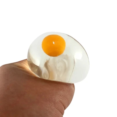 Juguete huevo juguete anti estrés huevo doble yema scuishy suave