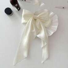 可愛的2入組女士黑色、米色和白色蝴蝶結髮夾與飄帶，半綁髮配飾充滿青春和甜美感。絲綢材質光滑有光澤，帶有3D效果。尺寸適中、可愛，適合日常佩戴。