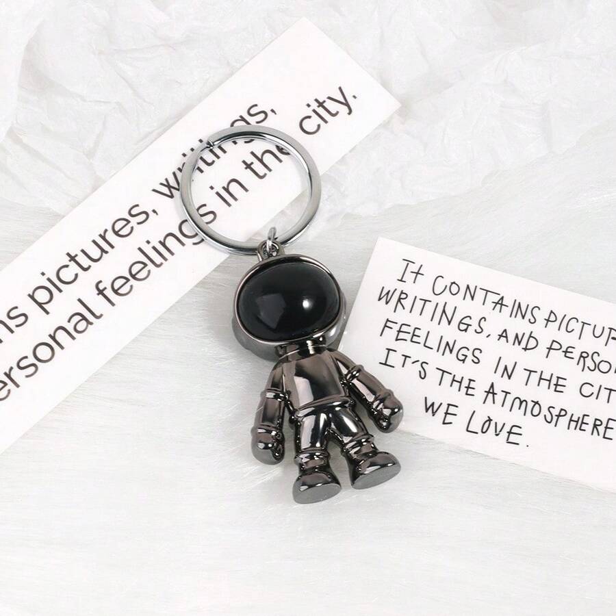 1入組黑色太空人設計塑料鑰匙扣,時尚可愛的背包吊飾,車輛裝飾,畢業紀念品