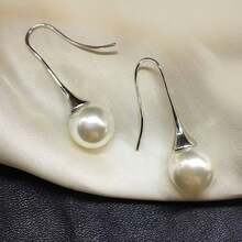 1對時尚優雅純色設計人造長假珍珠吊墜耳環,適合女性日常佩戴和裝飾