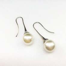 1對時尚優雅純色設計人造長假珍珠吊墜耳環,適合女性日常佩戴和裝飾