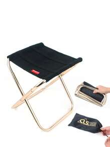 1張戶外摺疊椅,由鋁合金製成,適用於釣魚、燒烤、露營,攜帶方便且小巧