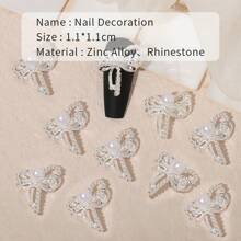 10 piezas de adornos de joyería de aleación de zinc en color plateado: moños, alfileres de cuello, decoraciones para arte de uñas, charms y gemas para uñas