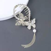 这款镶钻、仿珍珠和流苏蝴蝶造型发夹，适合盘发、丸子头、马尾辫等各种发型，打造波西米亚风情，是派对造型的理想之选。它也是女士发饰的必备单品。 - 金色 - 查看 3