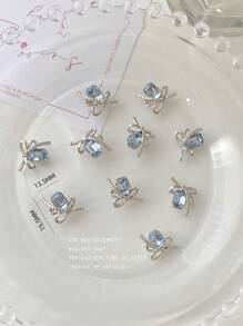 Decoración de arte de uñas 3D con piedras rectangulares octagonales de color azul cielo, cadena plateada, mariposa y 10 piezas de gemas de aleación brillante, charms de uñas, piedras preciosas para uñas y suministros para uñas