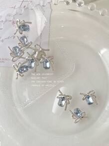 Decoración de arte de uñas 3D con piedras rectangulares octagonales de color azul cielo, cadena plateada, mariposa y 10 piezas de gemas de aleación brillante, charms de uñas, piedras preciosas para uñas y suministros para uñas